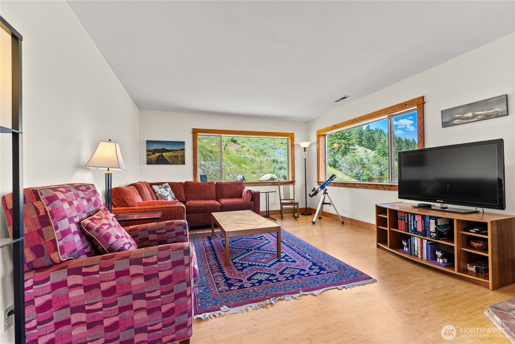 427 Rendezvous Road Winthrop, WA 98862 - Photo 13 of 40 a living room with furniture and a flat screen tv