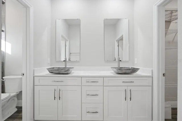 a bathroom with a sink and mirror