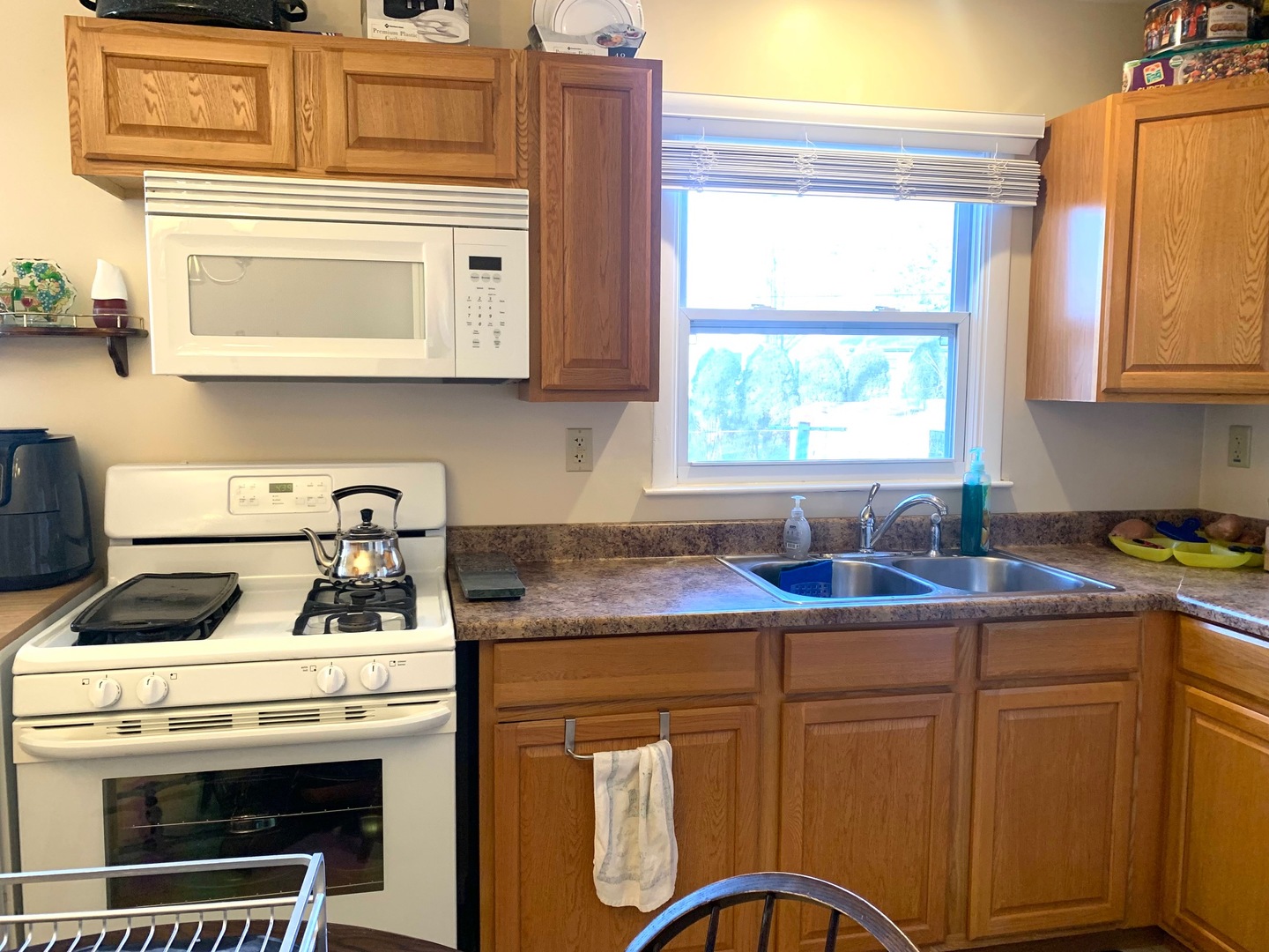 677 Walnut Road Wauconda, IL 60084 - Photo 4 of 10 a kitchen with granite countertop a stove sink and cabinets