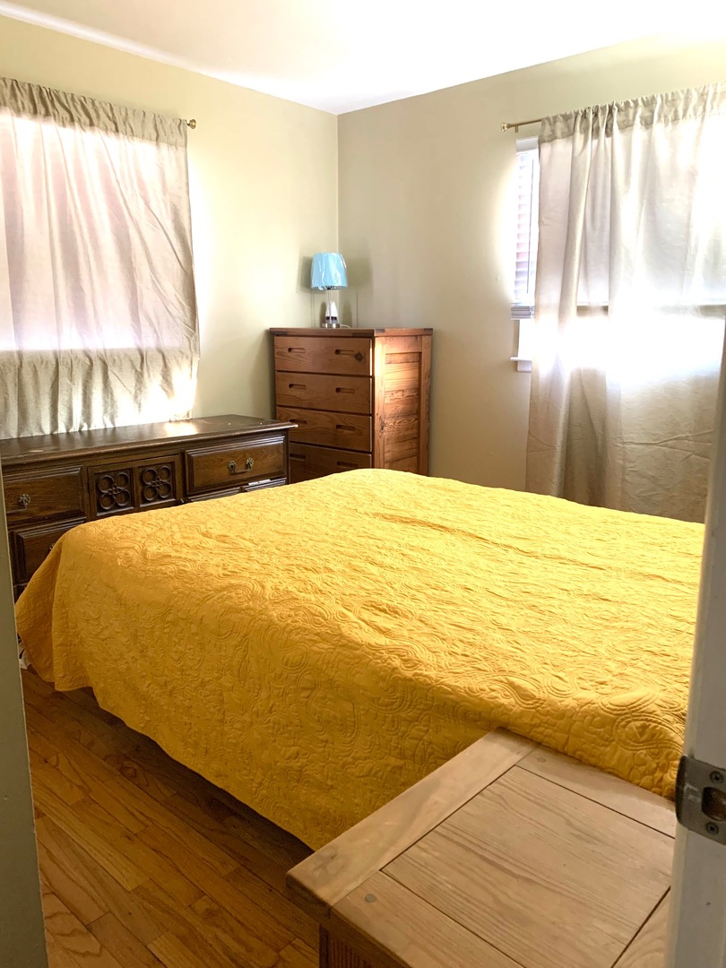 677 Walnut Road Wauconda, IL 60084 - Photo 5 of 10 a bed sitting in a bedroom next to a window