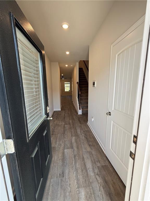 124 Meadowview Drive Temple, GA 30179 - Photo 3 of 16 a view of hallway with stairs and wooden floor