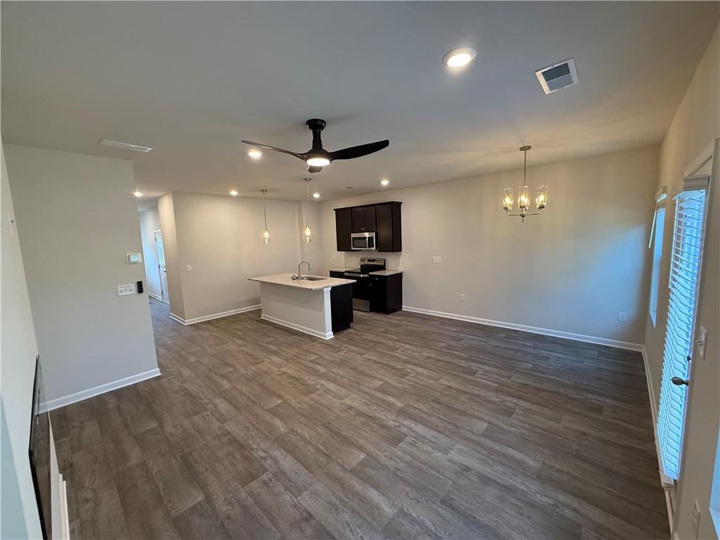 124 Meadowview Drive Temple, GA 30179 - Photo 7 of 16 a view of a kitchen with a sink and a refrigerator