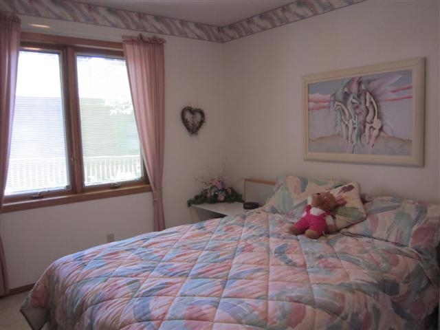 858 Breckenboro Road Lake Summerset, IL 61019 - Photo 17 of 24 a bedroom with a bed and a window