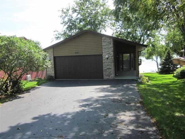 858 Breckenboro Road Lake Summerset, IL 61019 - Photo 3 of 24 a front view of a house with a yard and garage
