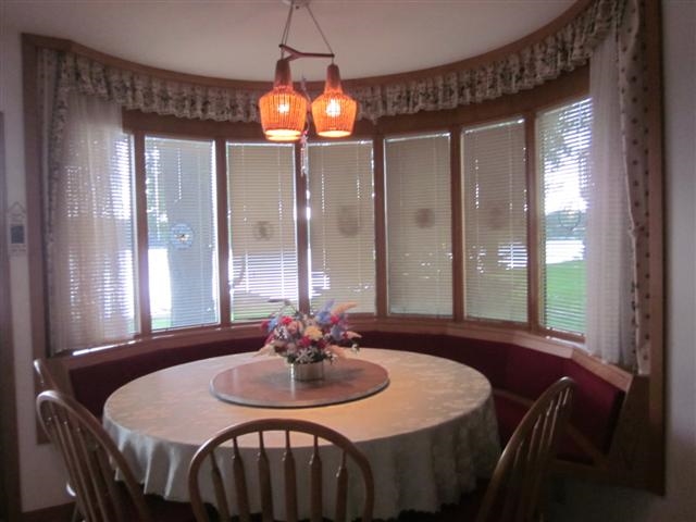 858 Breckenboro Road Lake Summerset, IL 61019 - Photo 5 of 24 a dining room with furniture a chandelier and window