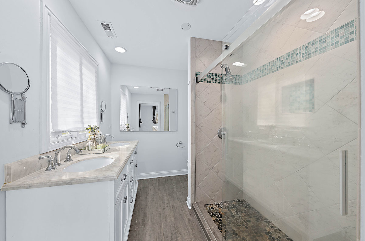 29-w045 Wagner Road Naperville, IL 60564 - Photo 14 of 34 a bathroom with a sink a toilet a mirror and shower