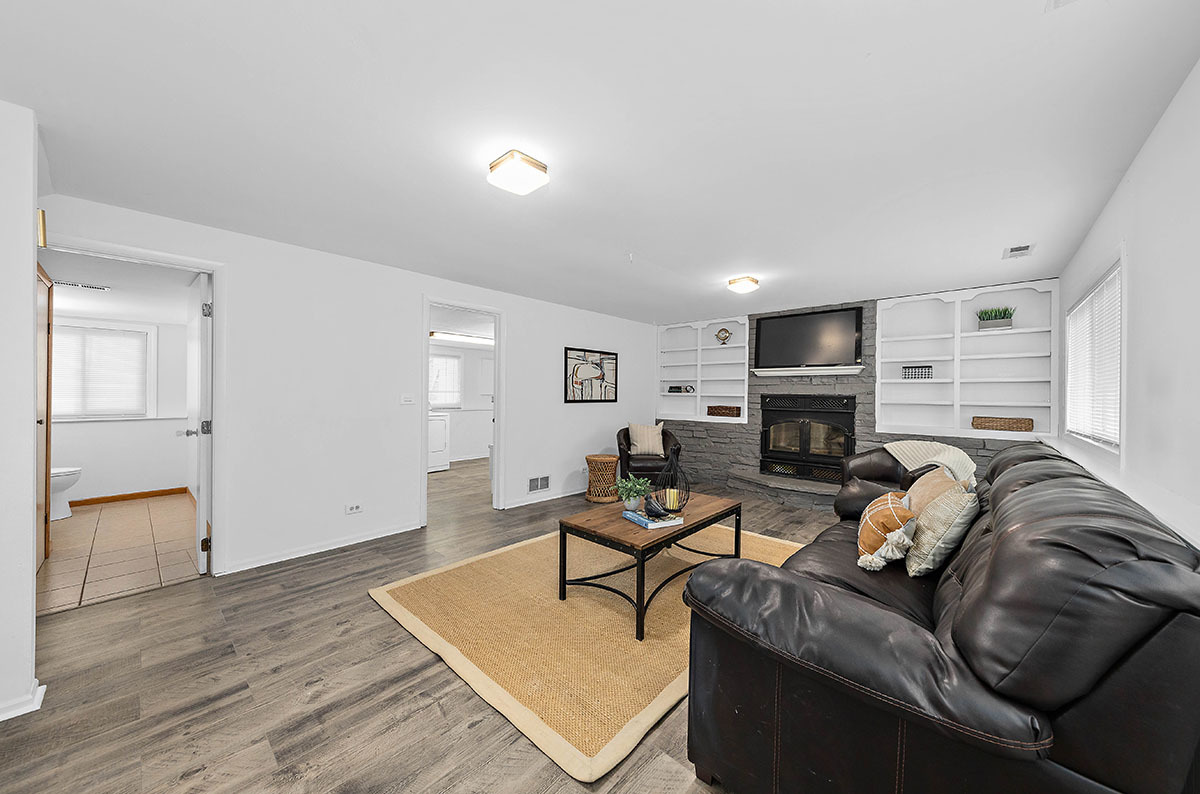 29-w045 Wagner Road Naperville, IL 60564 - Photo 23 of 34 a living room with furniture and a fireplace