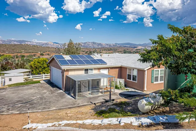 a view of a chairs and tables in the patio