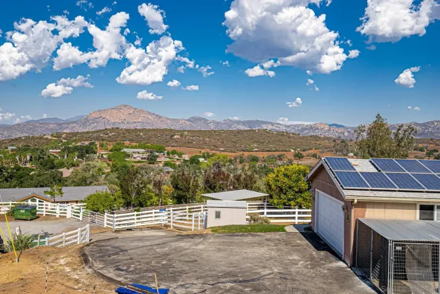 a view of a house with backyard porch and furniture