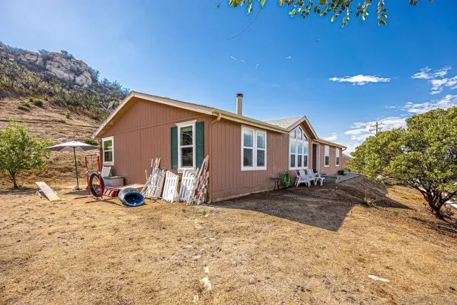 an aerial view of a house having yard