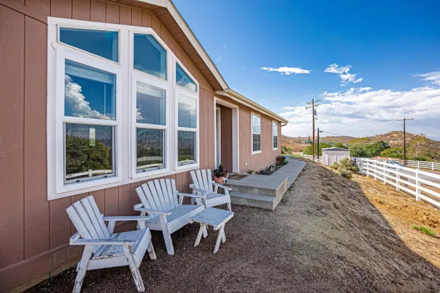 an aerial view of a house with outdoor space