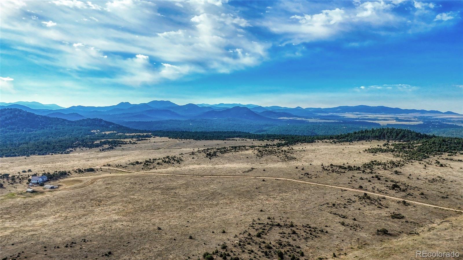 705 Riggs Road Westcliffe, CO 81252 - Photo 21 of 30 a view of a mountain with wooden fence