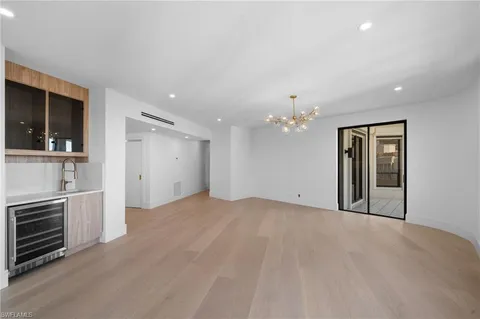 a view of a kitchen with a sink dishwasher and a refrigerator