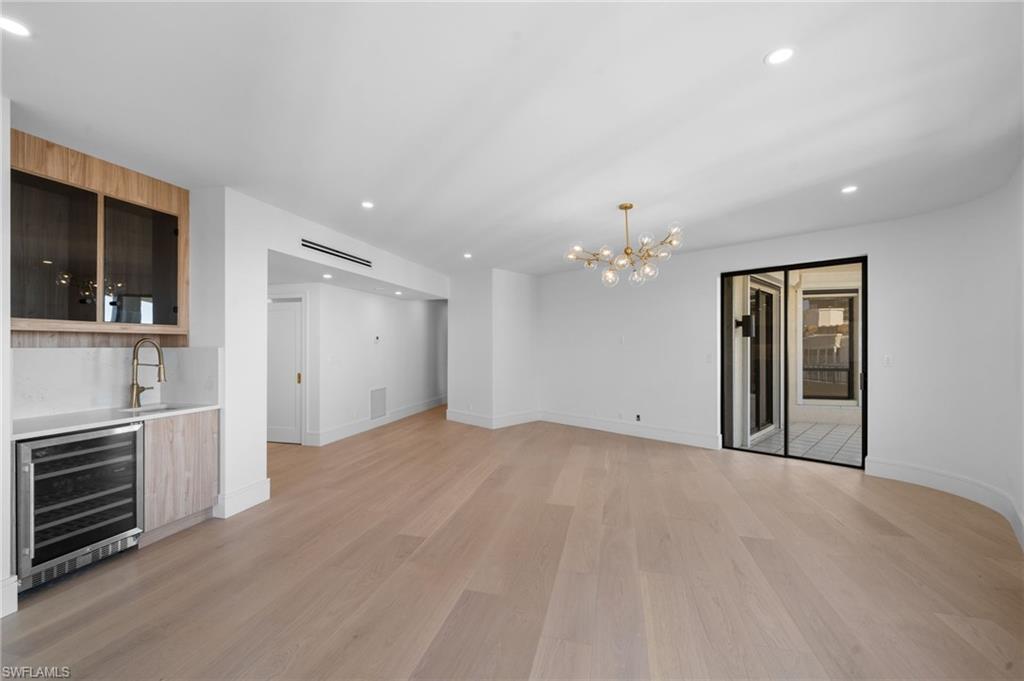 4451 Gulf Shore Boulevard North, Unit 2002 Naples, FL 34103 - Photo 13 of 36 a view of a kitchen with a sink dishwasher and a refrigerator