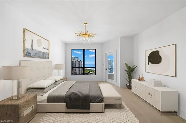 a spacious bedroom with a large bed and a window