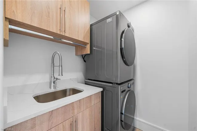 a close view of utility and utility room with washer and dryer