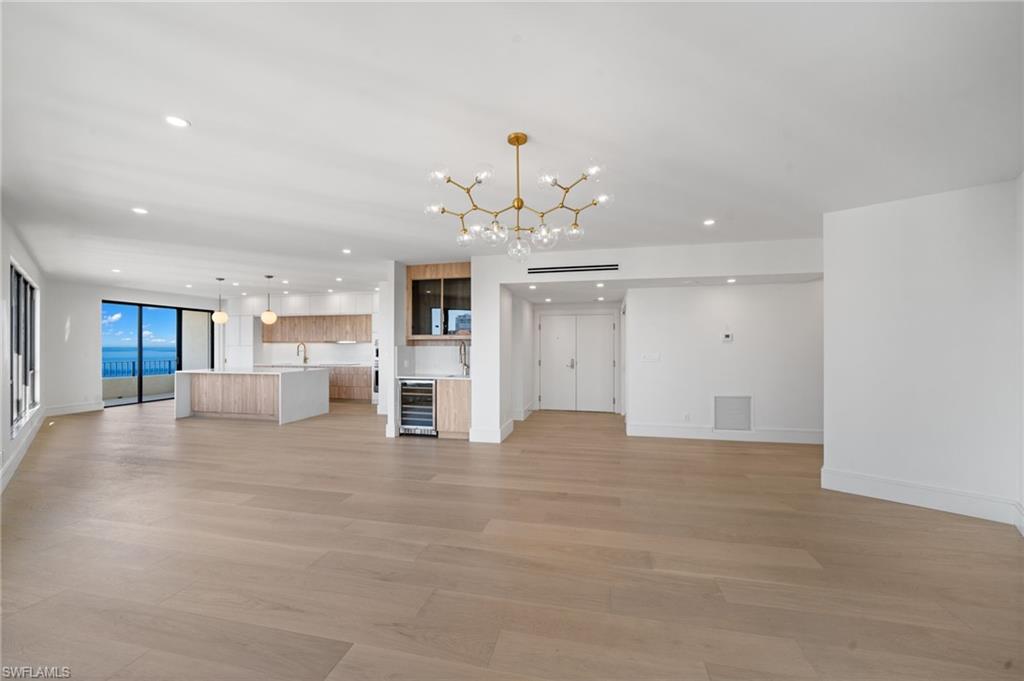 4451 Gulf Shore Boulevard North, Unit 2002 Naples, FL 34103 - Photo 5 of 36 a view of an empty room with kitchen and window