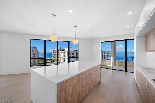 a view of a room with window and furniture