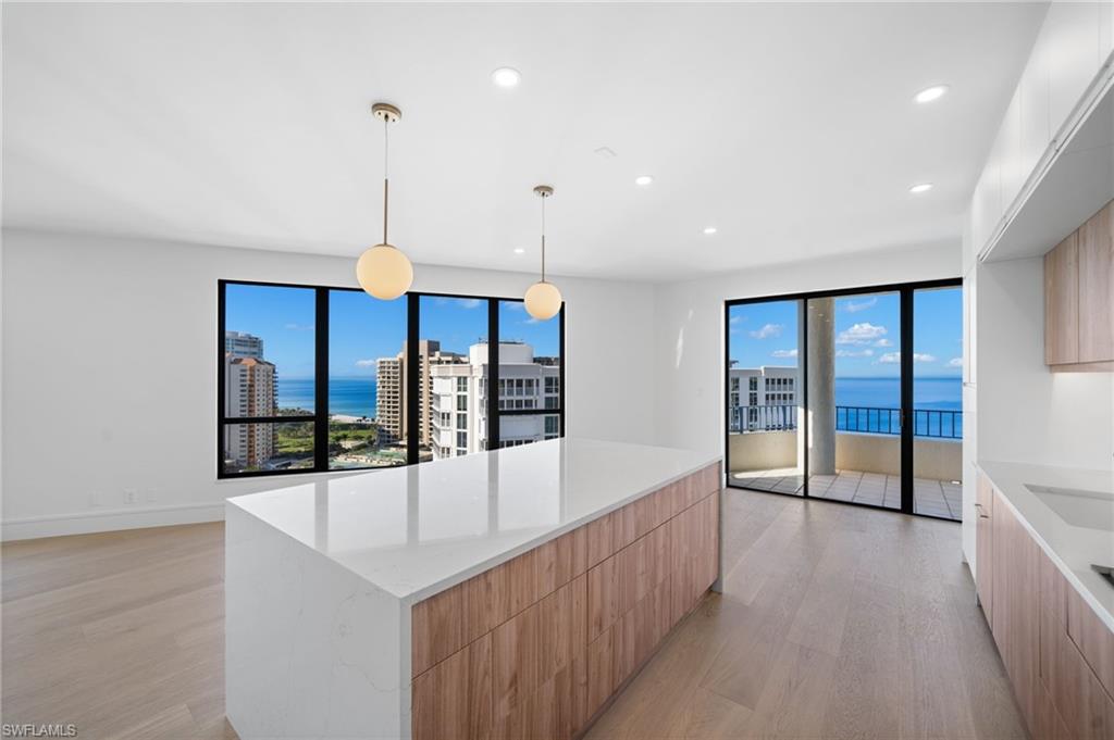 4451 Gulf Shore Boulevard North, Unit 2002 Naples, FL 34103 - Photo 10 of 36 a view of a room with window and furniture