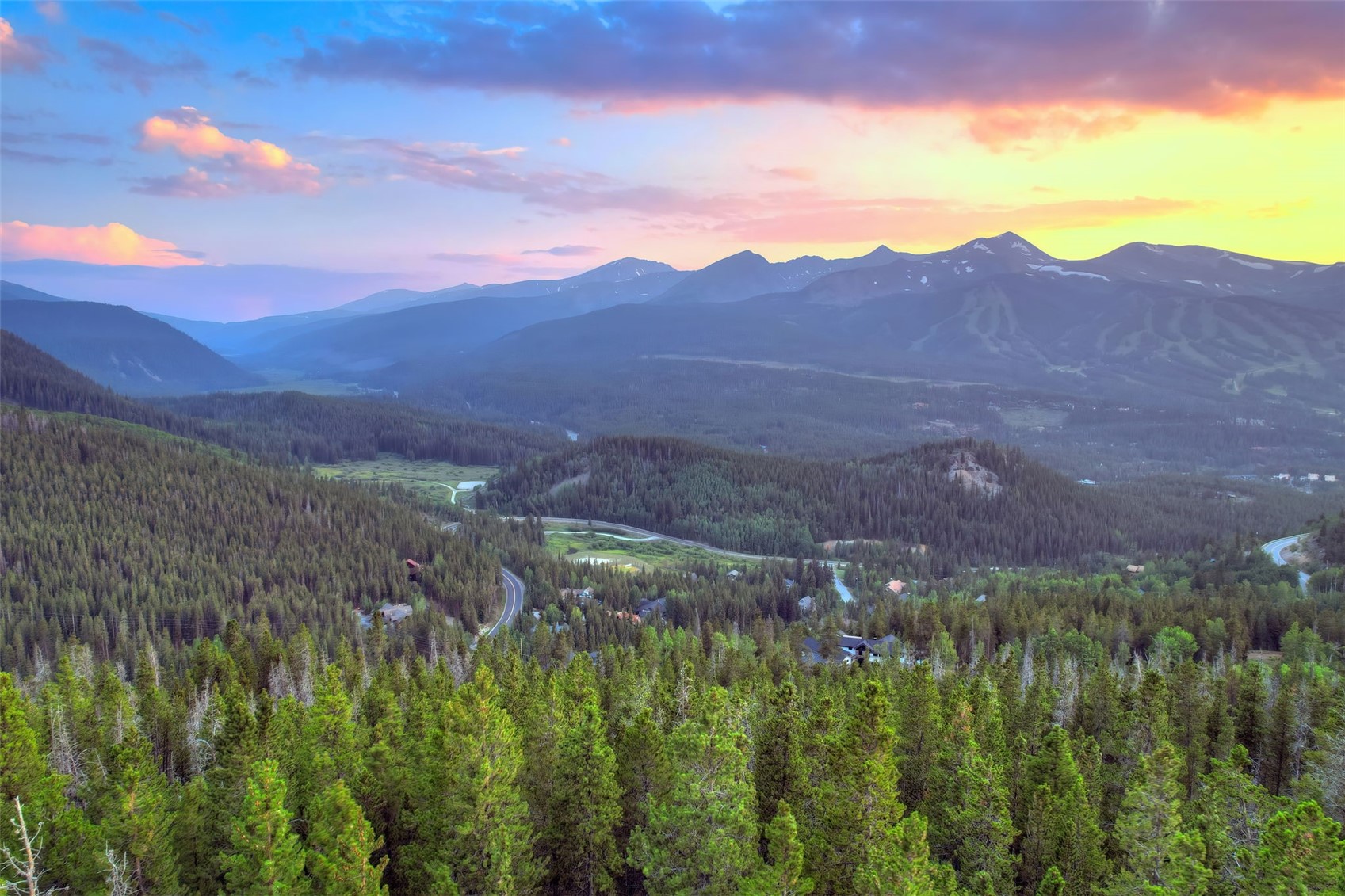 2211 Boreas Pass Road Breckenridge, CO 80424 - Photo 9 of 20 a view of a lush green hillside and a mountain