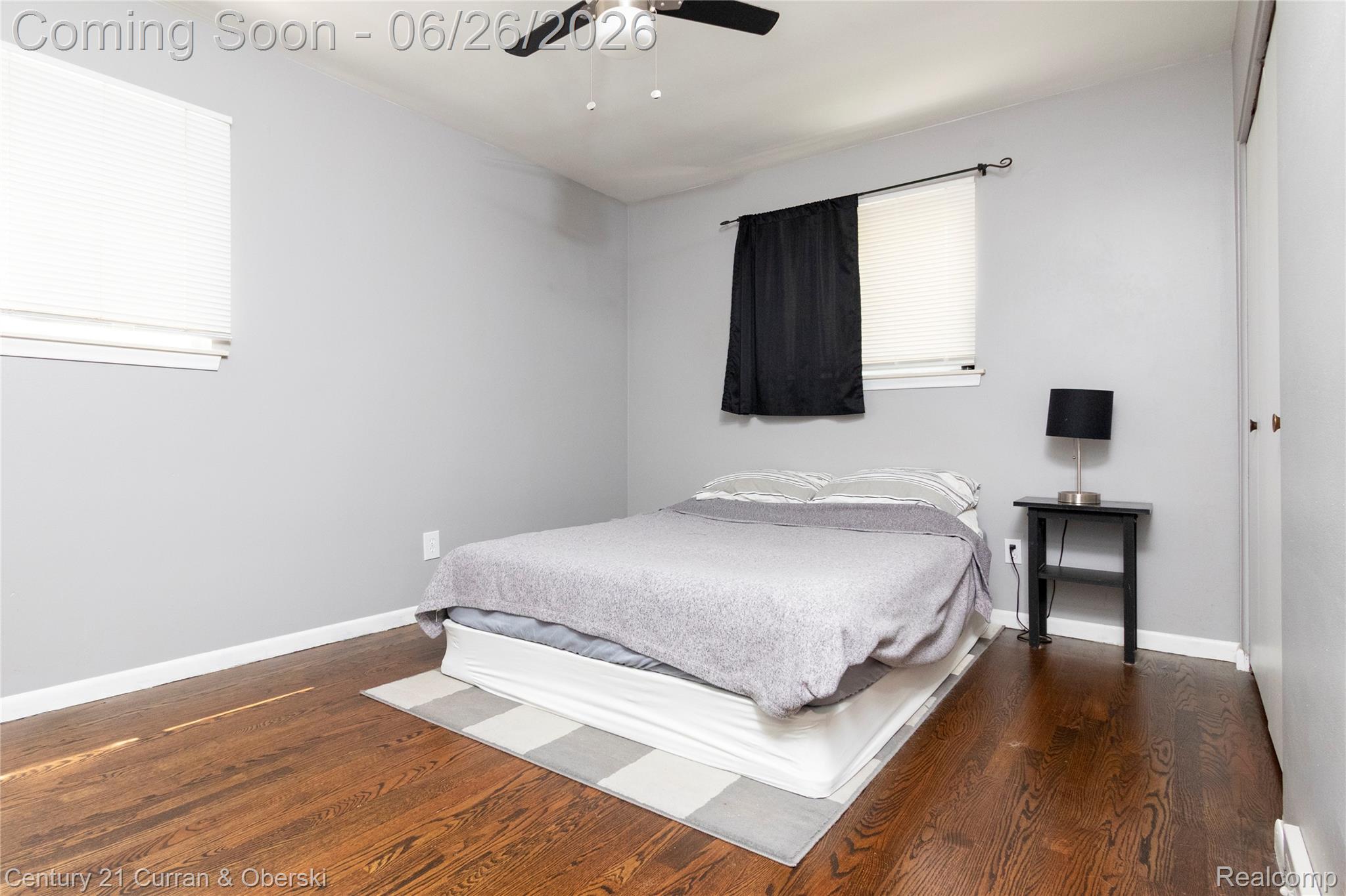 3220 Alice Street Dearborn, MI 48124 - Photo 22 of 39 Bedroom featuring wood-finish flooring, light gray wall paint, and white baseboards