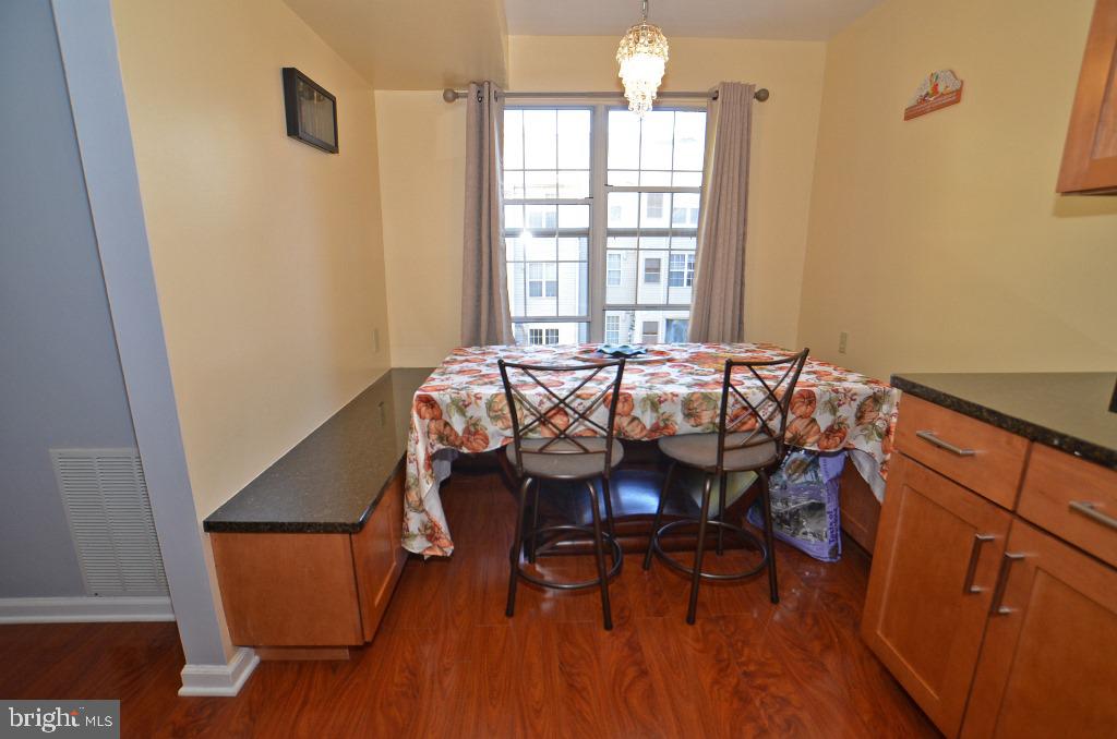 14913 Cleese Court, Unit 4AD Silver Spring, MD 20906 - Photo 5 of 22 Dining room with built in bench/shelving