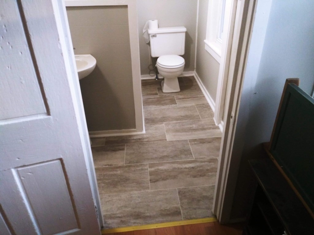 51 Pleasant Street Ware, MA 01082 - Photo 12 of 17 a bathroom with a sink and a toilet