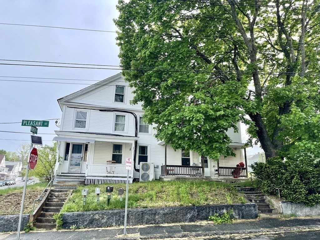 51 Pleasant Street Ware, MA 01082 - Photo 2 of 17 a front view of a house with a yard