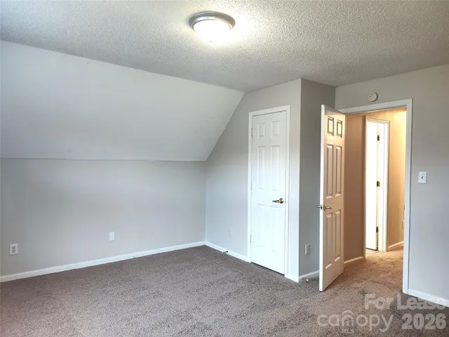 an empty room with closet area