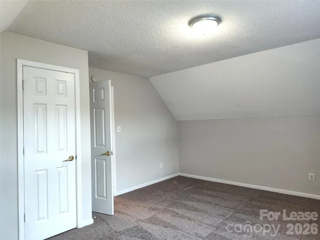 an empty room with wooden floor