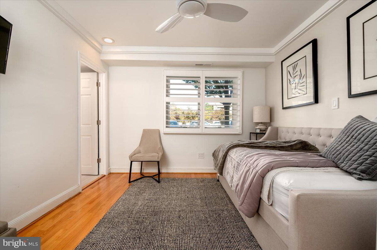 2125 Quay Village Court, Unit T1 Annapolis, MD 21403 - Photo 24 of 36 a bedroom with a bed and wooden floor