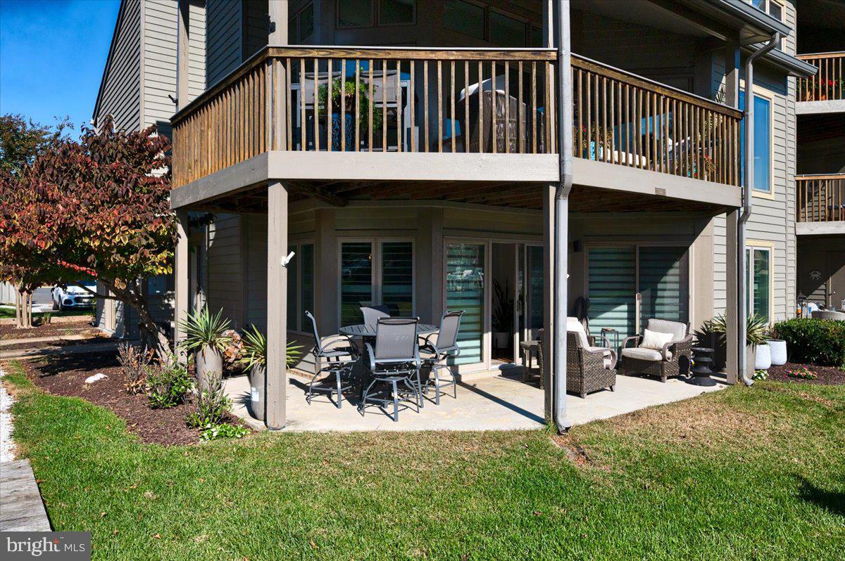 2125 Quay Village Court, Unit T1 Annapolis, MD 21403 - Photo 32 of 36 a view of a house with a patio and a garden