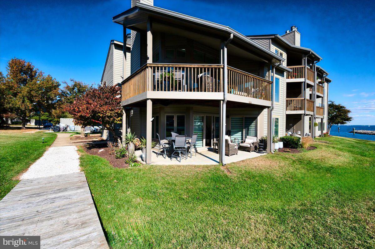 2125 Quay Village Court, Unit T1 Annapolis, MD 21403 - Photo 33 of 36 a view of a house with sitting area and garden