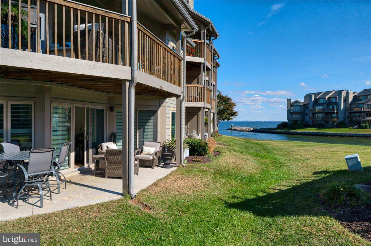 2125 Quay Village Court, Unit T1 Annapolis, MD 21403 - Photo 34 of 36 a view of a house with a yard and sitting area