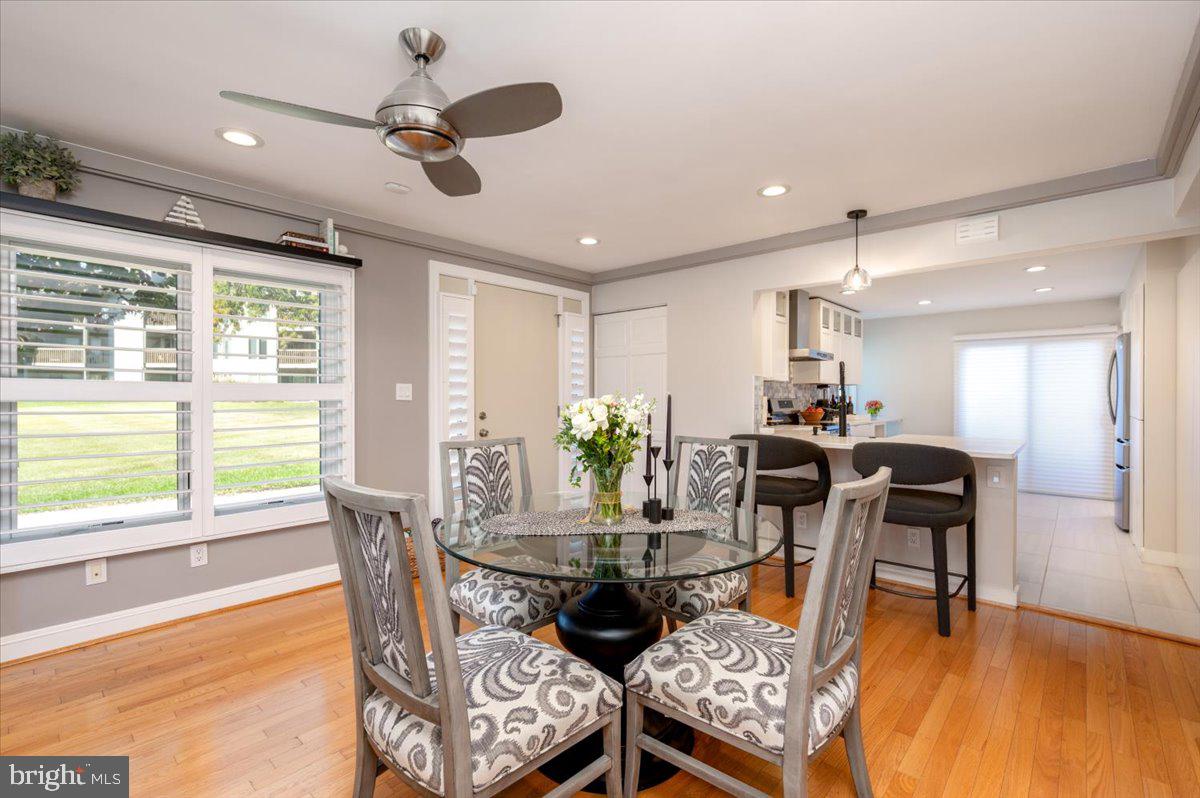 2125 Quay Village Court, Unit T1 Annapolis, MD 21403 - Photo 9 of 36 a dining room with furniture a window and wooden floor