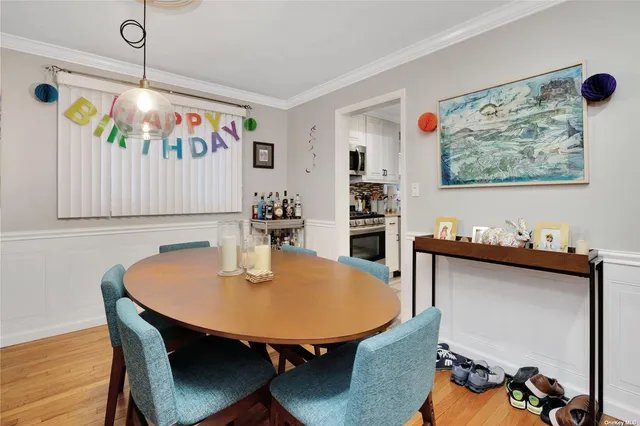 a kitchen with stainless steel appliances a stove a sink and a refrigerator