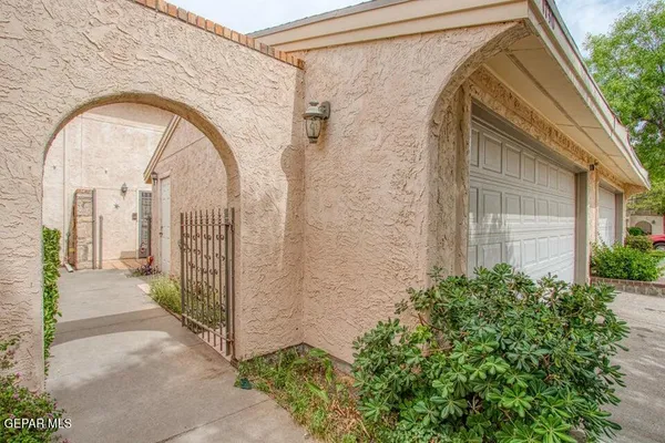 a view of entrance gate of a house
