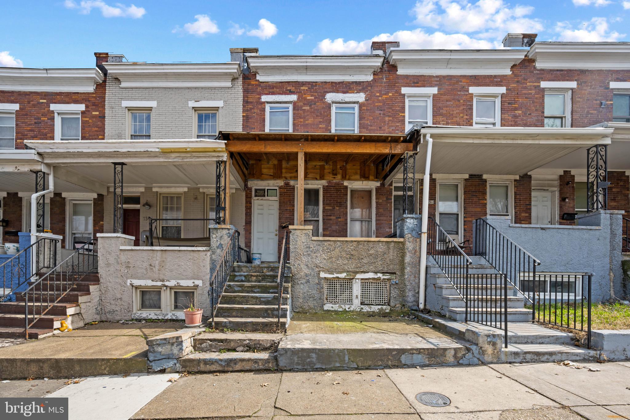 2349 Annapolis Road Baltimore, MD 21230 - Photo 1 of 11 a front view of a residential apartment building with a garden