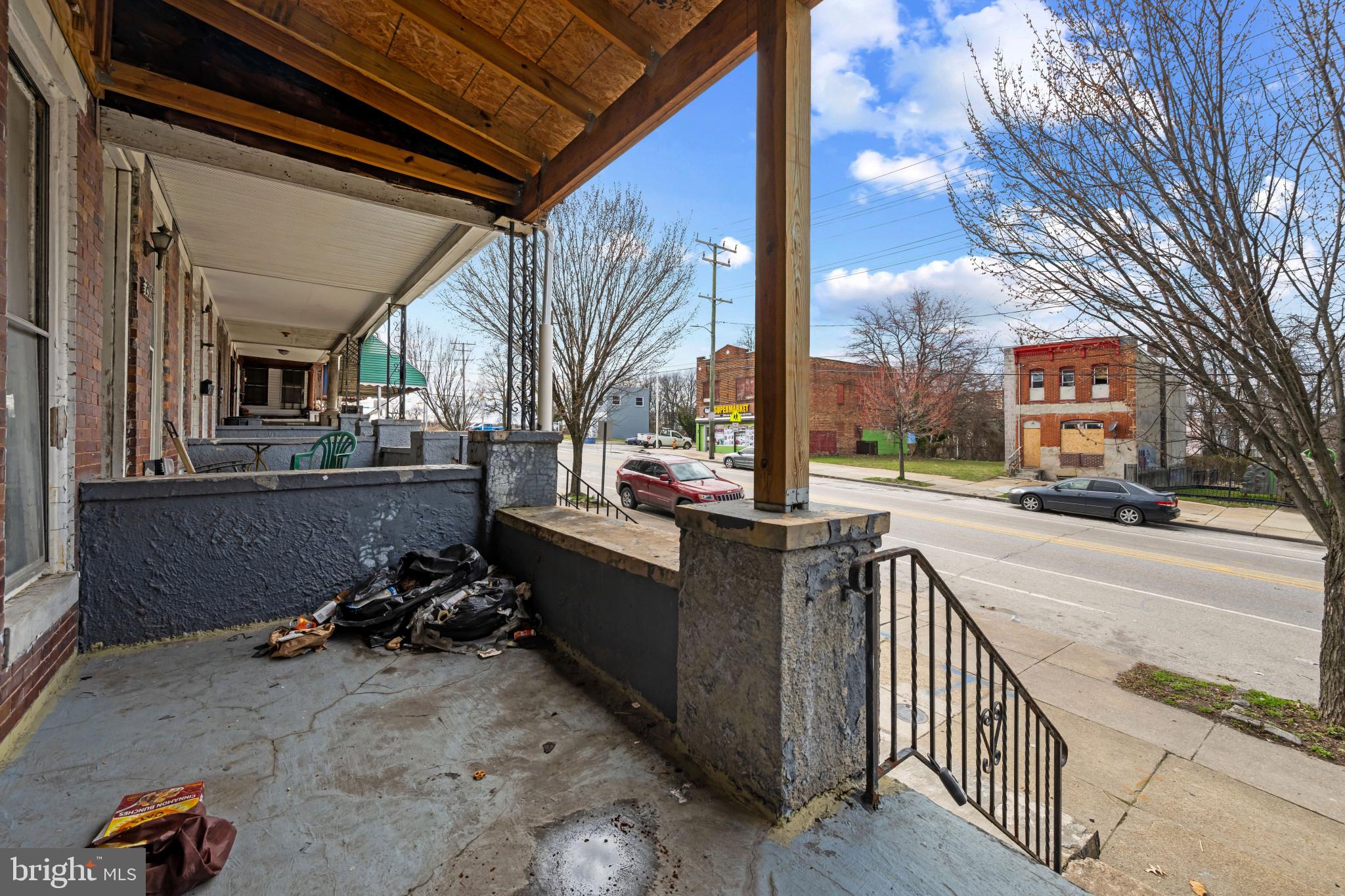 2349 Annapolis Road Baltimore, MD 21230 - Photo 5 of 11 a view of a porch with wooden floor and fence