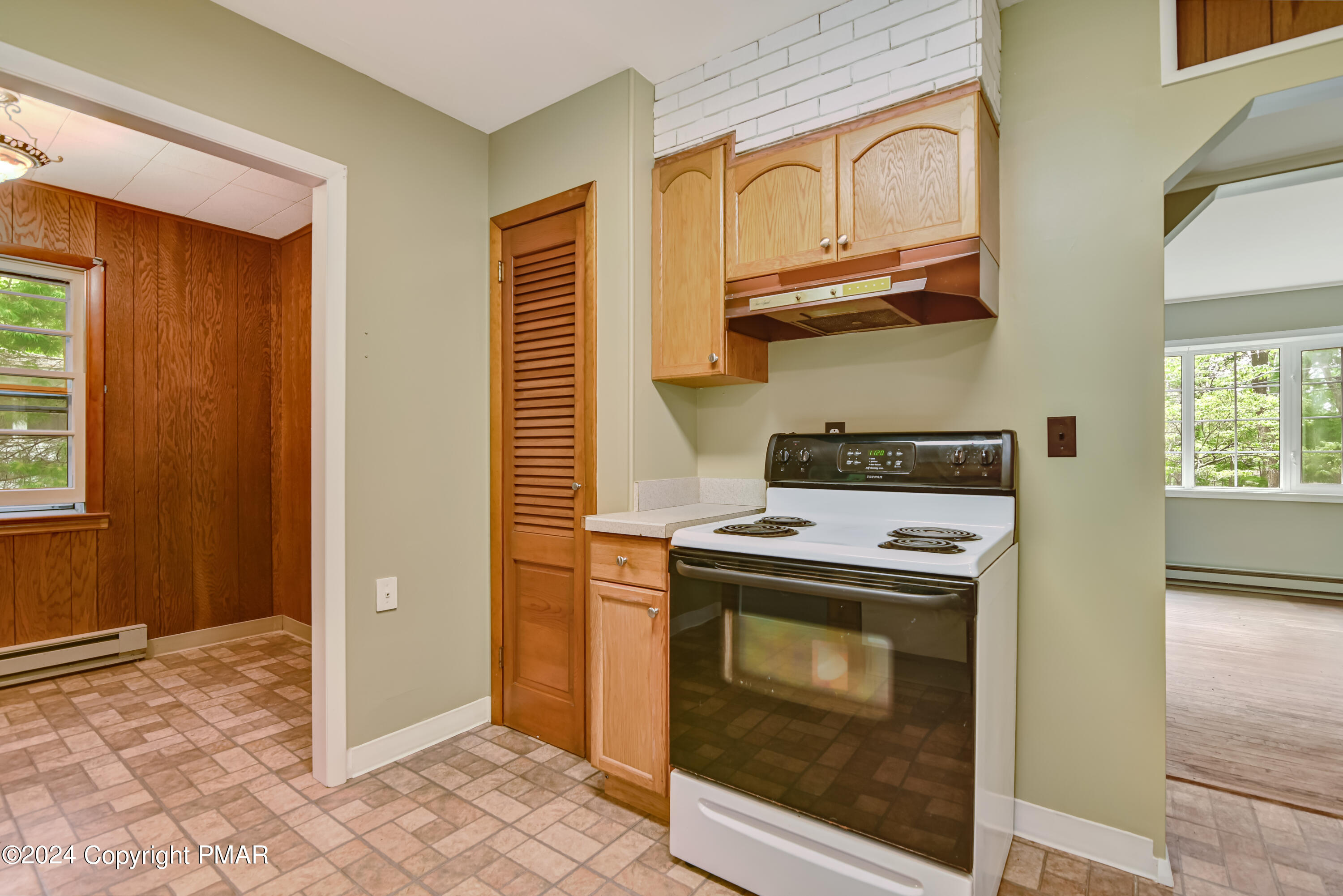 205 Aspen Road Dingmans Ferry, PA 18328 - Photo 14 of 29 a kitchen with stainless steel appliances granite countertop a stove and a refrigerator