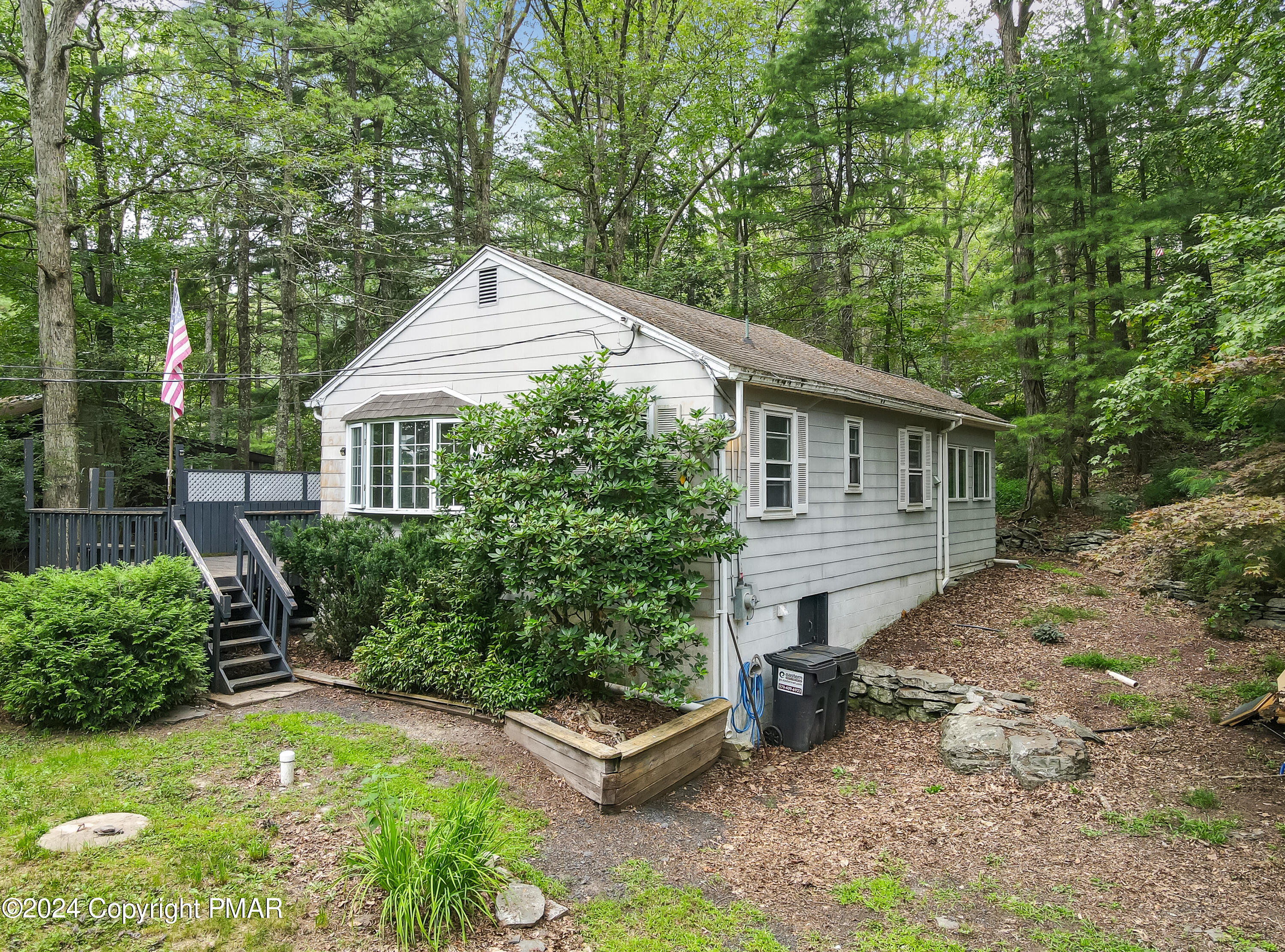 205 Aspen Road Dingmans Ferry, PA 18328 - Photo 2 of 29 a front view of a house with garden