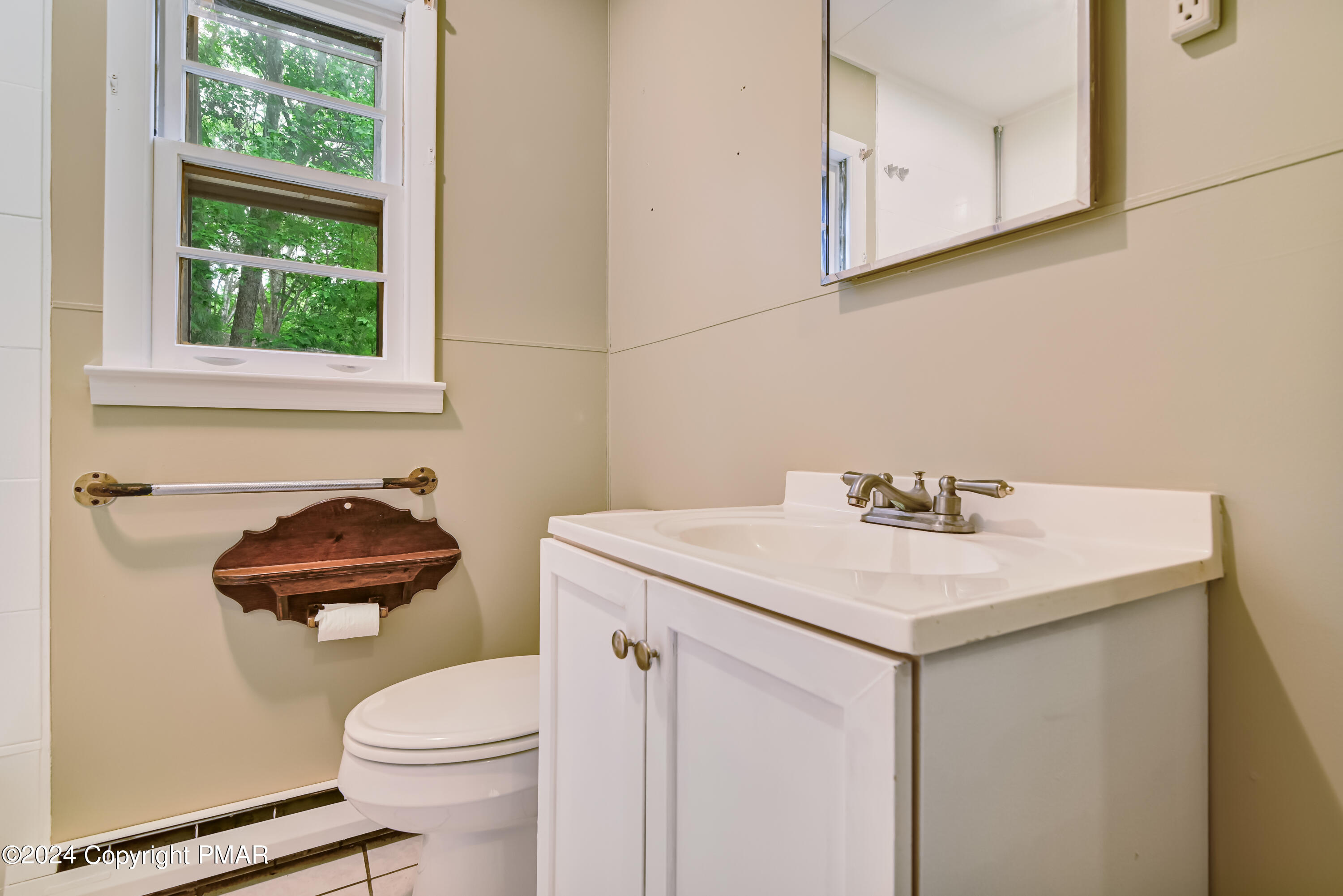 205 Aspen Road Dingmans Ferry, PA 18328 - Photo 23 of 29 a bathroom with a sink a toilet and a mirror
