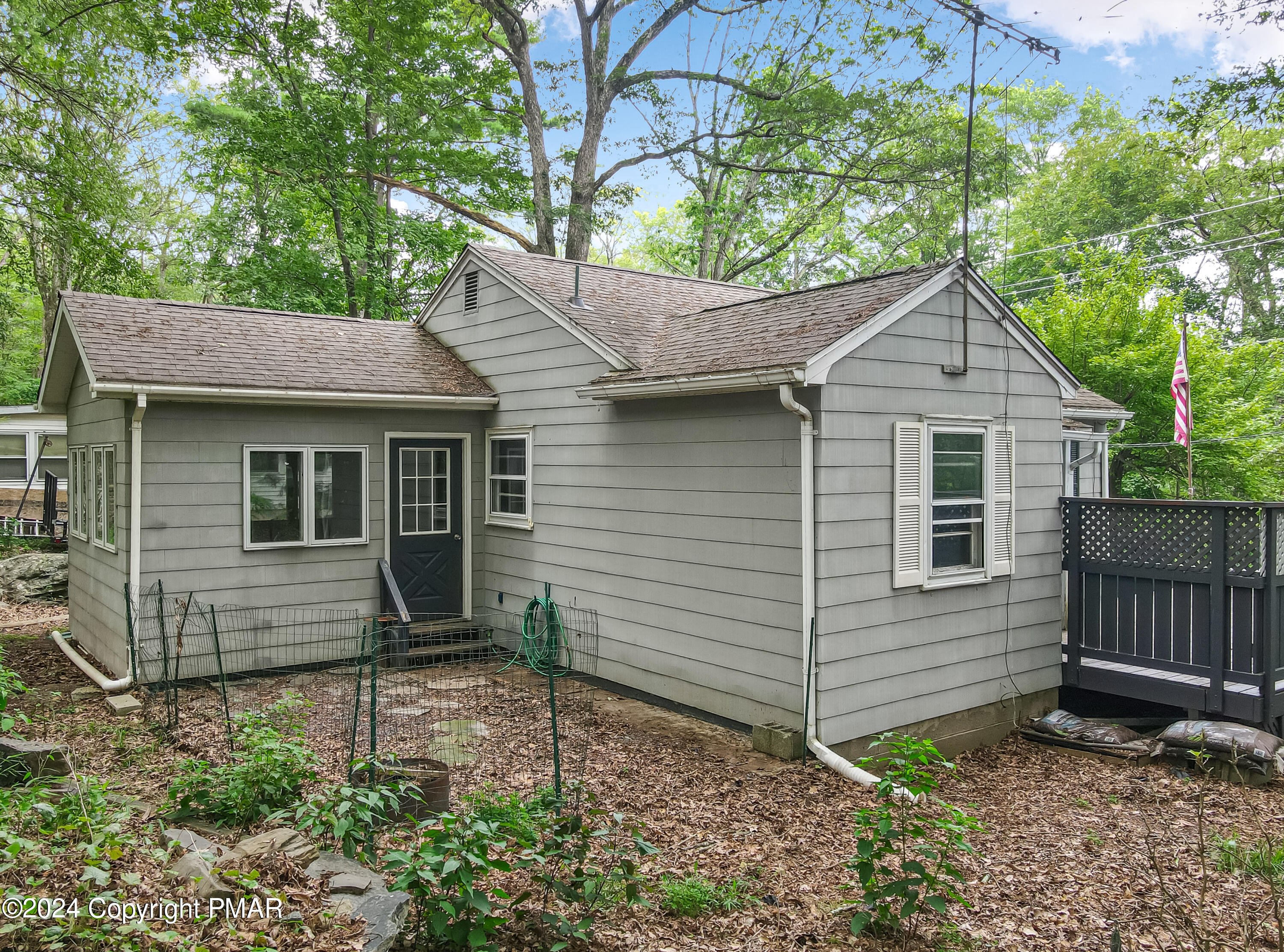 205 Aspen Road Dingmans Ferry, PA 18328 - Photo 28 of 29 a view of a house with a yard