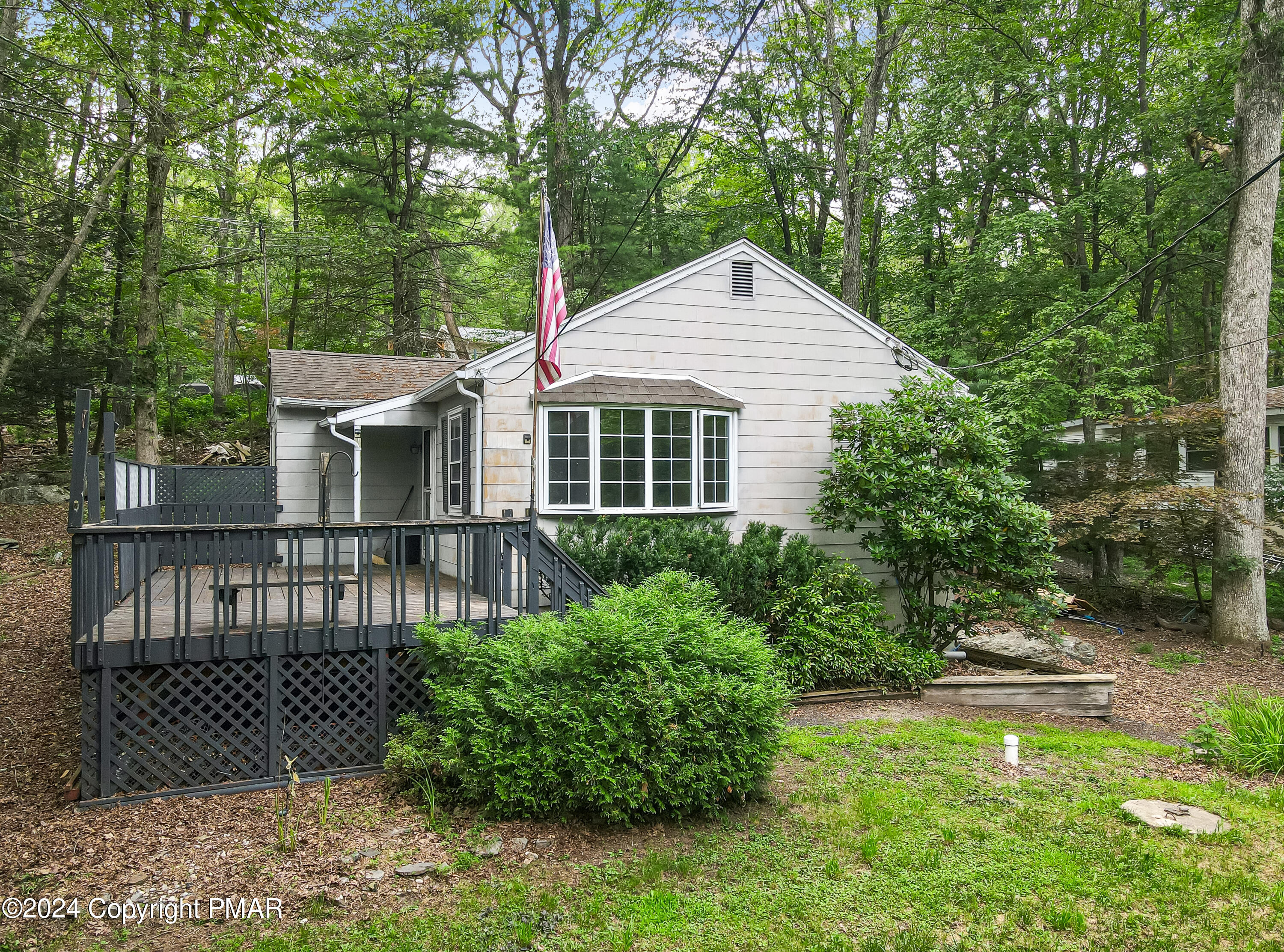 205 Aspen Road Dingmans Ferry, PA 18328 - Photo 4 of 29 a front view of a house with a garden
