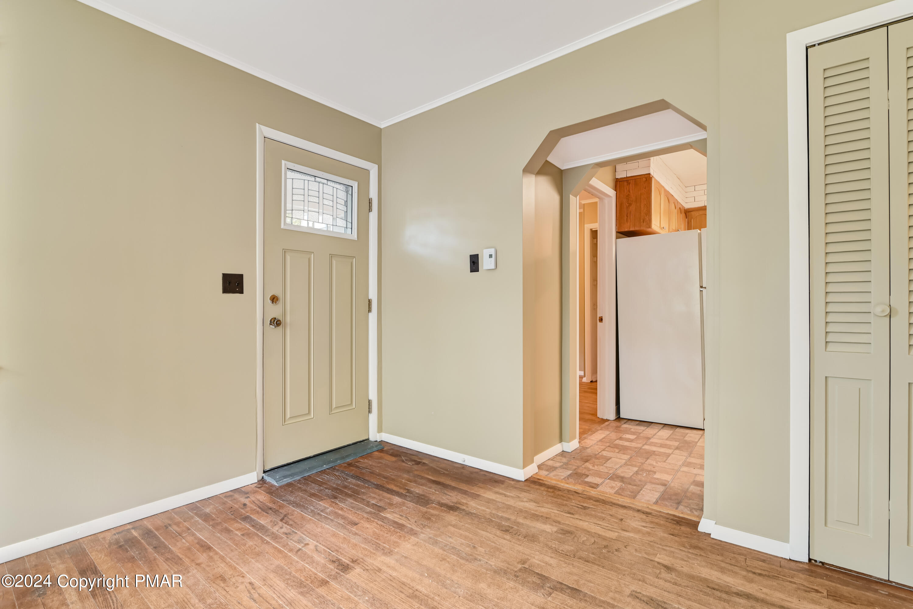 205 Aspen Road Dingmans Ferry, PA 18328 - Photo 7 of 29 a view of an empty room with wooden floor and entryway