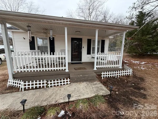 a view of a house with a fence