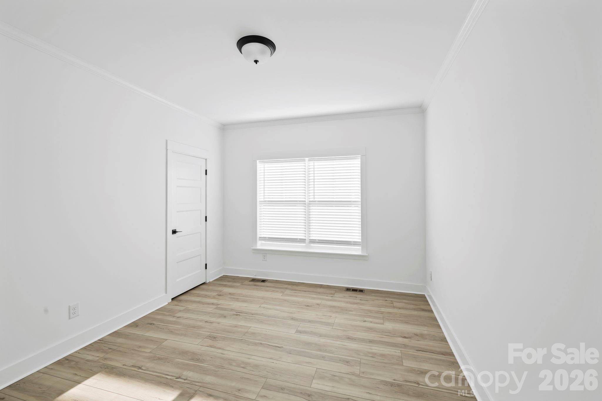 204 Southern Charm Road Arden, NC 28704 - Photo 20 of 24 an empty room with a window