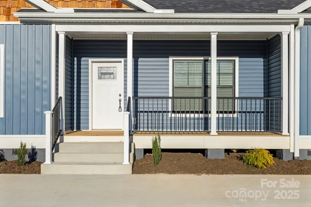 a small house with a bench in front of it