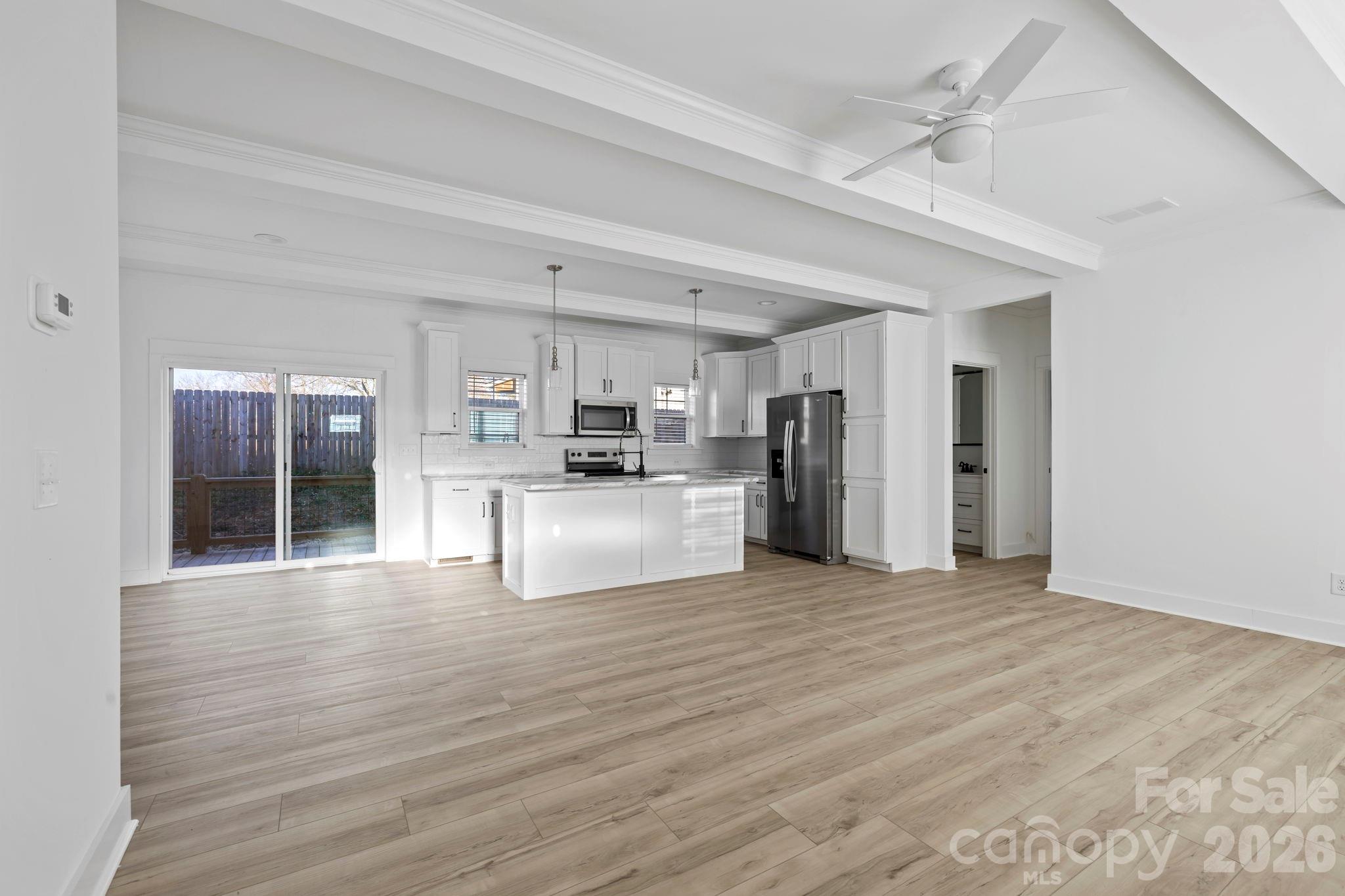 204 Southern Charm Road Arden, NC 28704 - Photo 3 of 24 a view of kitchen with refrigerator microwave and stove