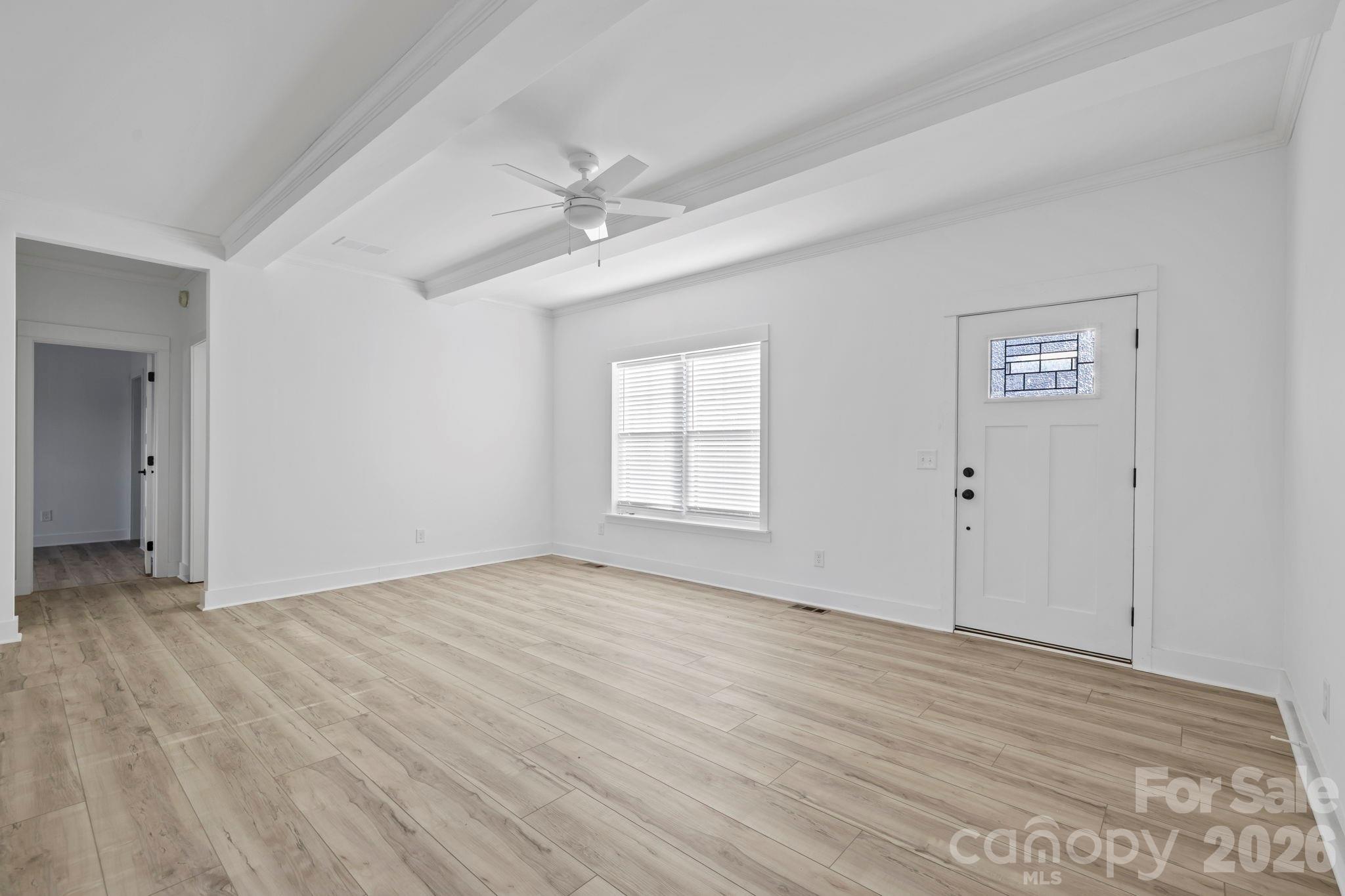 204 Southern Charm Road Arden, NC 28704 - Photo 5 of 24 a view of empty room with wooden floor and fan
